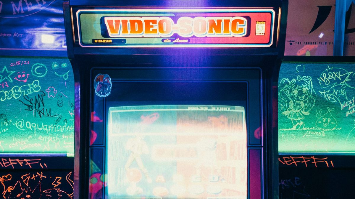 A glowing retro arcade game cabinet, the kind of game kids can learn to build