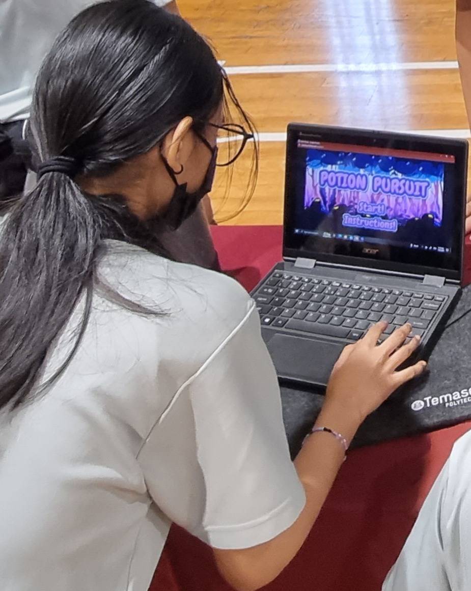 A student playing a game built by a classmate during a DotCode Campus session