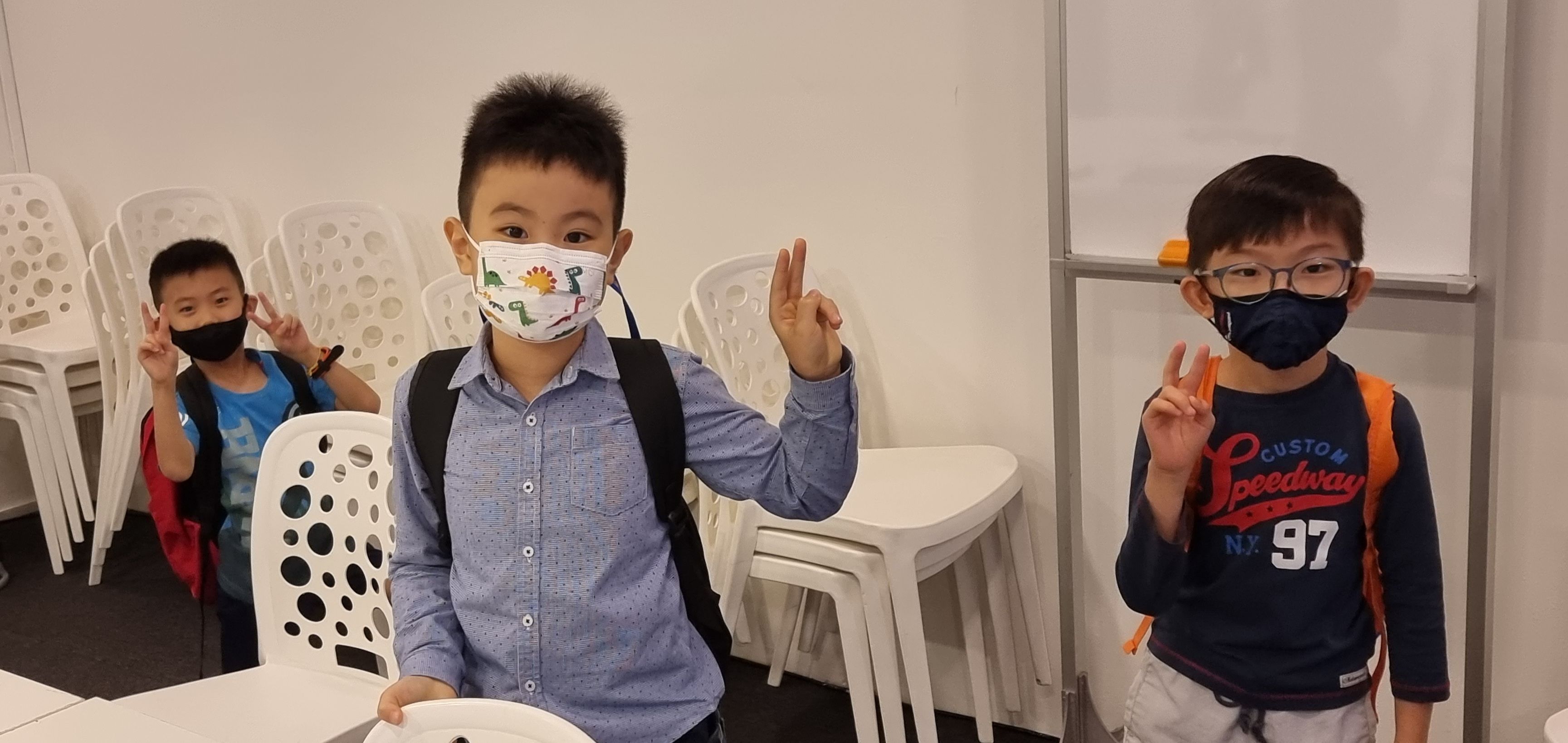 Young coding students smiling together at DotCode Campus